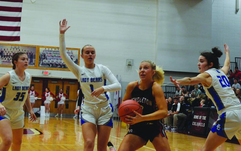 Sophomore Lilly Ashcraft slashes through the Bracken County defense on her way to the basket during the 10th Region Quarterfinals. Photo by Sam McClanahan.