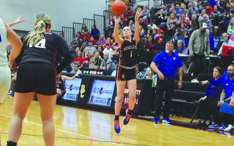 Pendleton County High School junior Madison Verst launches one of her five three-pointers in a 50-48 regional playoffs win March 5 against Bracken County. It was the Ladycats first win in regionals in 13 years. The LadyCats lost in the next round. Playoffs coverage for both boys and girls teams begins on Page 10. Photo by Sam McClanahan.