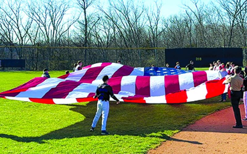 30 foot by 50 foot United States flag unfurled and steady during the playing of “The Star-Spangled Banner”