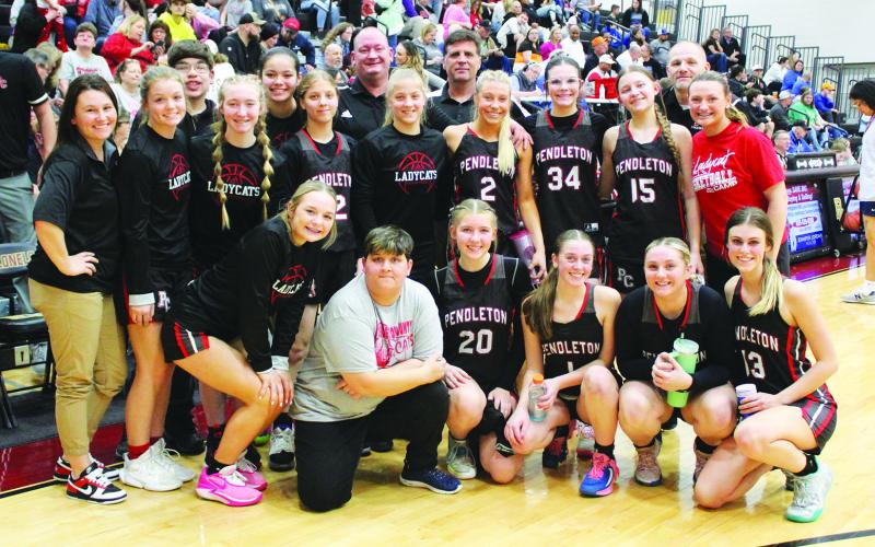 The Ladycats were all smiles following their 50-48 victory over Bracken County. It was their first regional tournament win in 13 years. Photo by Stacey Myers.