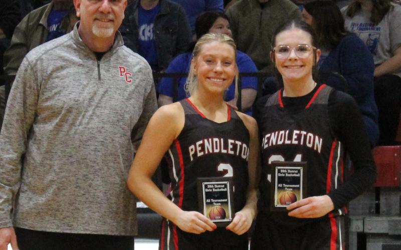 Following the conclusion of the 38th District Championship game, Ladycats sophomore Lilly Ashcraft (center) and freshman Hannah Spaulding (right) were named to the all-tournament team. Photo by Stacey Myers.
