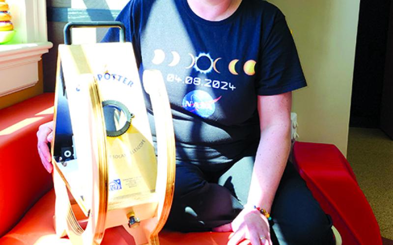 Pendleton County Public Library Programming Assistant Hannah Pearson describes the workings of the Sunspotter, one of several pieces of equipment the library will discuss Friday during a free Solar Eclipse Tips and Tricks event at Kincaid Lake State Park Conference Center in preparation for the total solar eclipse happening April 8. Photo by Burton Cole.