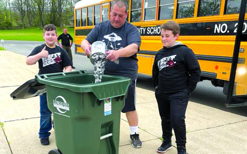 Bus driver Steve Haubner gets involved by adding his pop tabs to the collection. NES will continue to collect tabs for the Ronald McDonald House. The can tabs are recycled, with proceeds helping offset McDonald House utility expenses.  Photos courtesy of Jodi Gerhardstein