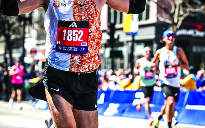 William Burns of Falmouth Burns crosses the finish line of the Boston Marathon in time of 2:46:27, finishing 833rd overall out of 25,530 entrants who completed the race April 15 in and around Boston. Burn said that the cheering crowds were a great motivator. Photo courtesy of William Burns.
