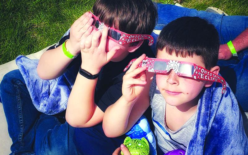 Logan and Ronin MacNeil of Butler were among the crowd that watched the total solar eclipse from outside the Armstrong Air and Space Museum in Wapakoneta. Their mother, Kira MacNeil, took the photo.