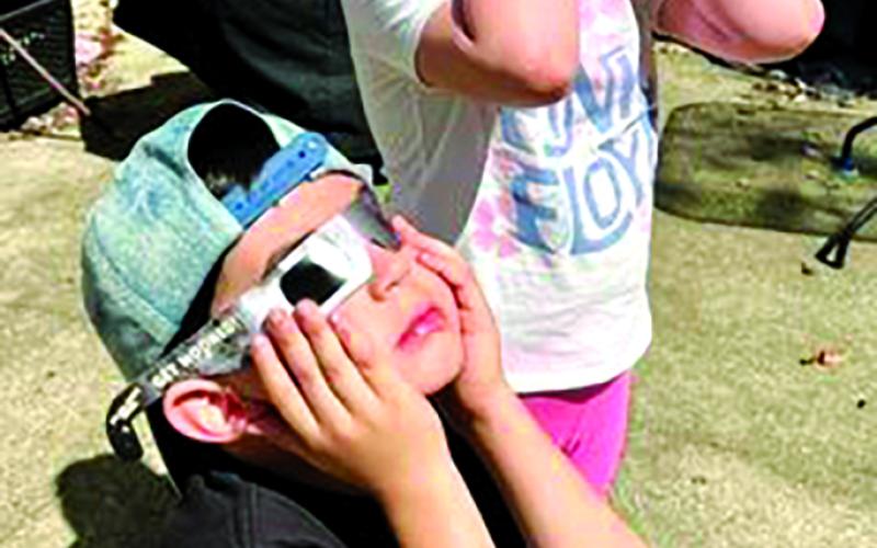 Pendleton County residents both stayed at home to view a 98.4 percent eclipse of the sun traveled a few miles to put themselves into the path of total solar eclipse.