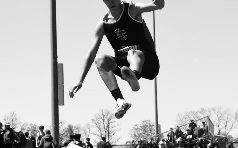 Wildcat Jamison Tucker goes airborne during his first place performance in the long jump competition. Photo courtesy of Beverly Beckett.
