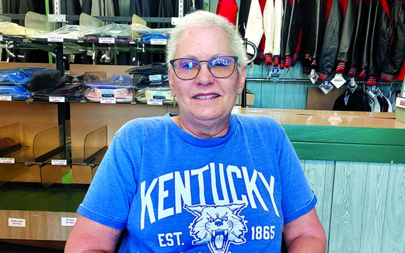 Lisa Houchen sits in the department store in Falmouth that's been part of Pendleton County history for more than a century. The store has closed and Houchen has retired from the family store. “You grow up on a farm, you learn how to do farm things,” Lisa said. “I grew up in a store so that was what I knew to grow up to do.” Photo by Jemi Chew.