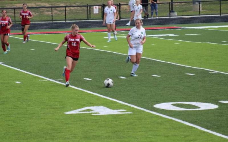 Ladycats Senior Addison Wright eyes the ball. Photo by Kacia Shipley.