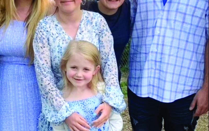 Callie Daughtery, left with her family.
