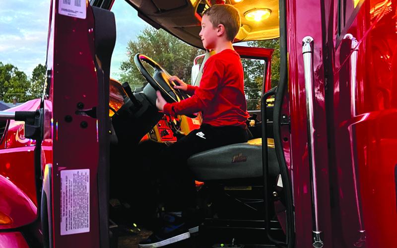 Youngsters get to experience the inside of emergency vehicles.