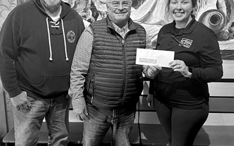 El Paso Mexican Restaurant, 516 Market St., Falmouth, stated that the outside of the building needs paint and new signage, and inside, the business needs a new walk-in cooler. The restaurant has been in business for 12 years and employs 20 people, according to owner Daniel Switzer. Pictured, Chamber representatives Randy Wells and Gary Hicks present a check to Emilee Marquez of El Paso.