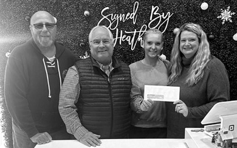 Signed by Heather Boutique, 26 Valley View Lane, Butler, plans to put its grant toward a new printer to cut out the middle man. Owner Heather Polley said her two-person operation is an approved vendor for Pendleton County Schools for their apparel, and that her boutique has been growing “at a 200% rate year after year” in the five years it’s been in business. Pictured, Chamber representatives Randy Wells and Gary Hicks present a check to Emily Jodrey and Polley.
