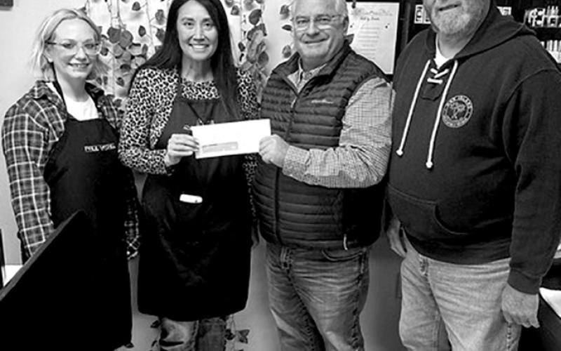 L&amp;L Beauty, 8160 Highway 27 N, Suite B, Butler, wants to upgrade equipment, replenish supplies and upgrade its space, according to owner Louisa Dunn. The salon has been in business for three years, and the four employees hand out 300 free haircut vouchers a year to school children, volunteer their services the annual Night to Shine event, among other contributions, Dunn said. Pictured, Erica Hughes, left, and Dunn accept their check from Gary Hicks and Randy Wells of the Chamber.