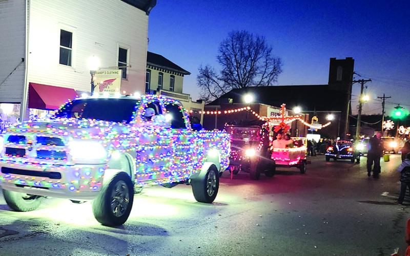 Since the sun had set by parade time, the colorfully festive lights adorning parade vehicles shown brightly.