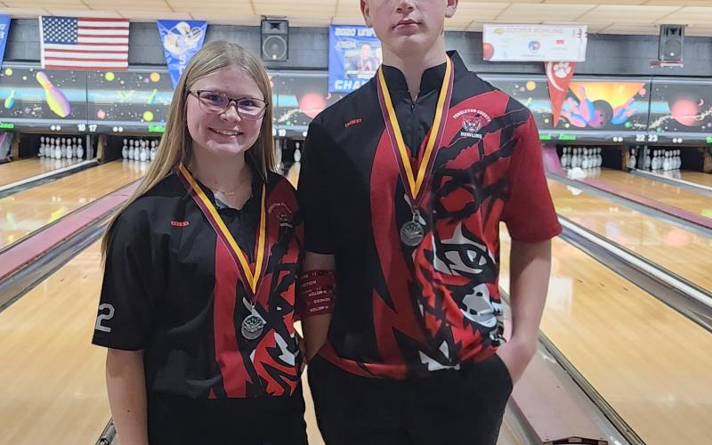 Kree and Kyan Brewer pose with their individual medalist awards.