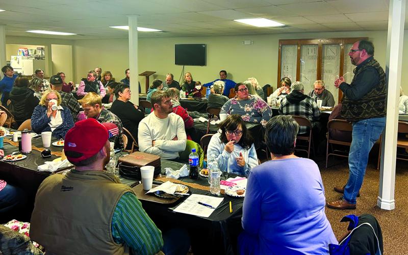 Pastor Darren Edwards, standing, addresses members, family and friends during a celebration on Jan. 19. The church was established Dec. 28, 1799, at the home of Brother Beuthel Riggs. Photo by Nila Harris.