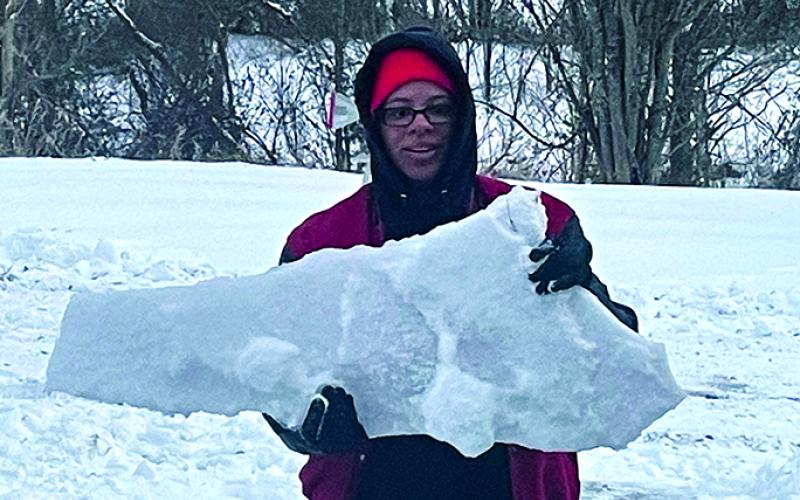 Hannah Conrad was breaking through the ice in the front yard of their home on Hayes Station Road in Falmouth when she came upon with this piece of ice in the shape of Kentucky. The ice is nearly one inch thick. It was surrounded by snow under and on top of it. The photo taken by her brother, Matthias “Ti” Conrad.