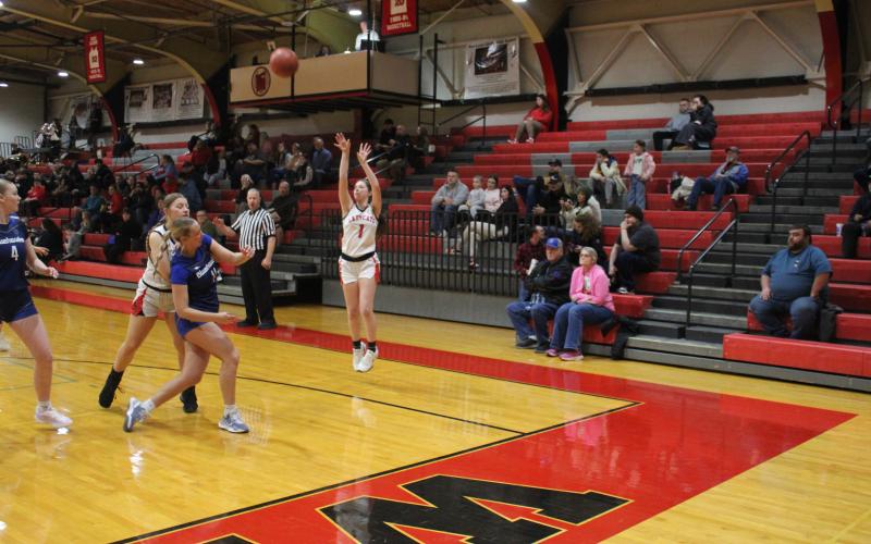 Senior Madison Verst launches a three-point attempt from the corner. Photo by Sam McClanahan