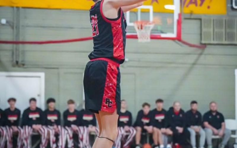 Sophomore Kamden O'Hara launches a three-pointer. Photos by: Sam McClanahan, Layne Nelson, and Justin Reckner.