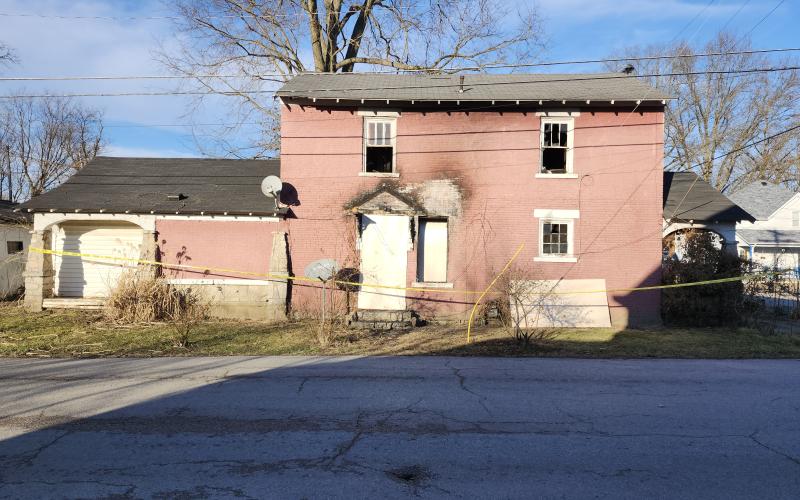 The historic brick building at Second and Maple streets in Falmouth received heavy damages in a Jan. 27 fire was the city's first jail in the early 1800s. It was boarded up over the weekend. Harold Macallister, who was buying the house from his brother Gary, who lived there, said he didn’t know if the building could be saved. Photo by Burton Cole.