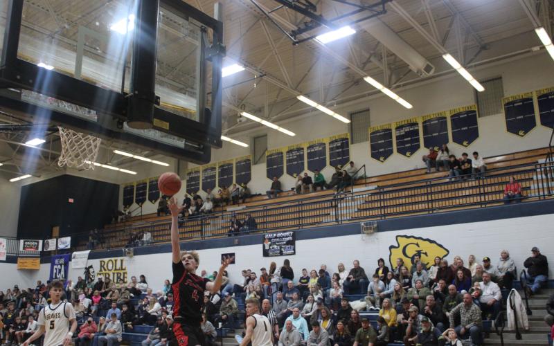 Sophomore Hunter Keeton rises for a one-handed floater during the team's road victory at Grant County on Feb. 21. Photo by Sam McClanahan