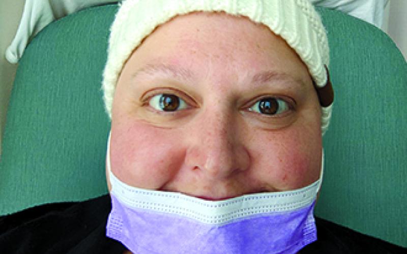 Miranda Geers of the Falmouth area smiles while undergoing a chemotherapy treatment. Geers was 41 — more than 20 years younger than normal — when diagnosed with ovarian cancer Feb. 13, 2021.
