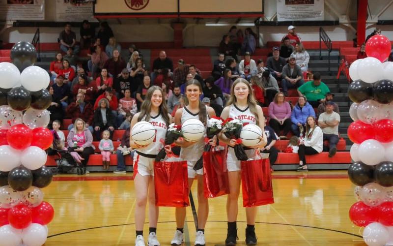 Prior to the start of the Ladycats home game with Robertson County on Feb. 8, the senior trio of Madison Verst (left), Kearstin Mayer (middle) and Skyler Thacker (right) were honored. Photo by Layne Nelson.
