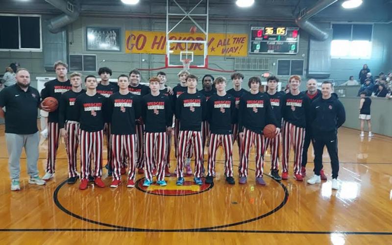 The Wildcats basketball team and coaching staff pose at midcourt prior to their game with Campbell County at Hoosier Gym.  Photos by: Sam McClanahan, Layne Nelson, and Justin Reckner.