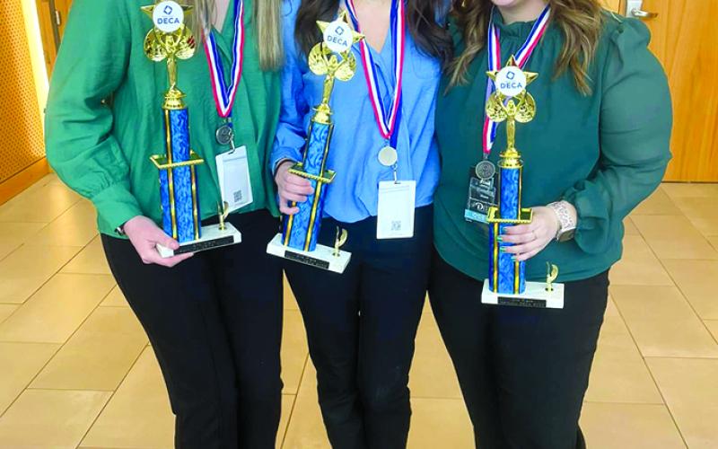 Kendra Hess, Hannah Cahill and Delaney Thompson finished in second place in the state DECA conference with their Career Development Plan.