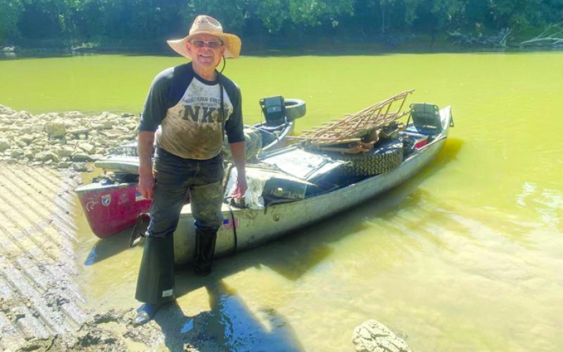 Robert “Boo” Singleton shows up his catch from another day of cleaning the river. Family photo.