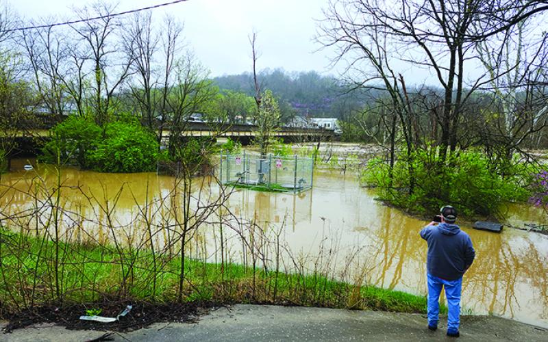 Waters of the South Fork Licking River nearly meet the U.S. 27 bridge in Falmouth Sunday. Photo by Burton Cole.