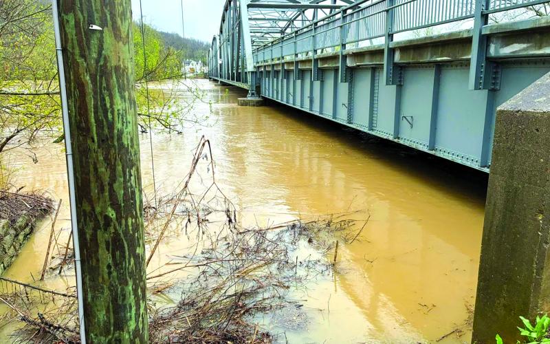 Waters threaten to overflow the bridge going into Butler. Photo posted by Mayor Mason Taylor.