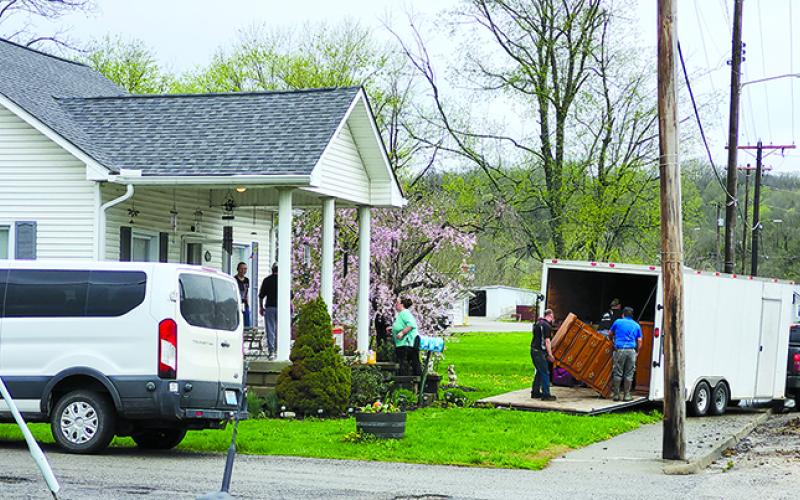 Friends and family load up a house on Shelby Street in Falmouth ahead of the mandatory evacuation order. Photo by Burton Cole.