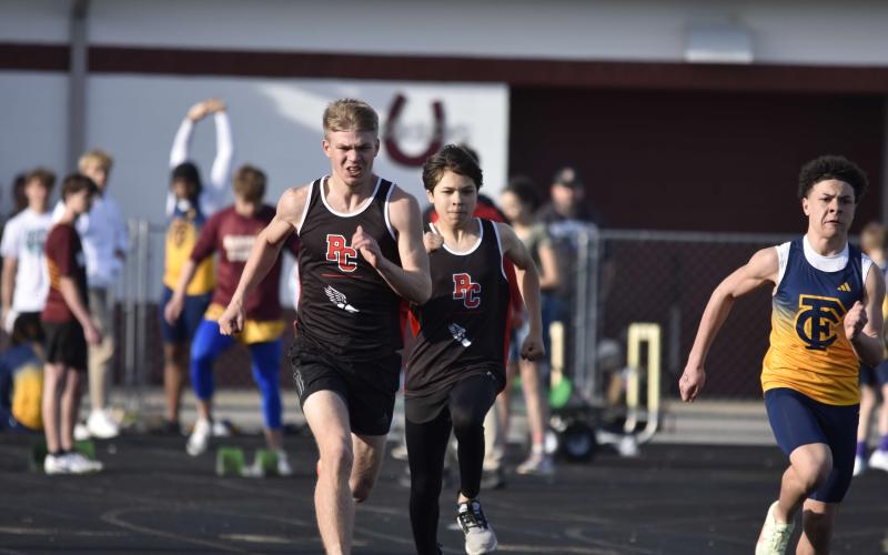PCHS Track members Sam Hodge, left, and Kai Ledone, right, compete in the  Unified 2x50 meter relay. Photo courtesy of Jennifer Redden.
