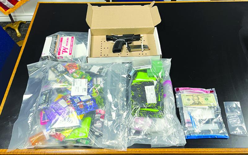 Suspected drugs, drug paraphernalia and weapons and ammo seized after a traffic stop in Falmouth are displayed at the police department. Photo courtesy of Falmouth Police Department.