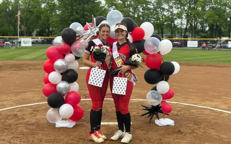 Ladycats Fastpitch Softball seniors Madison Verst, left; and Logan Cooper, right, were recognized along with their families during "Senior Night" activities prior to the start of the May 12 home matchup versus Grant County.  Photo by Sam McClanahan.