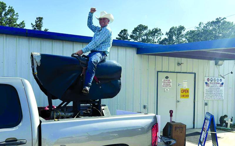 Gale Gregg of Falmouth rides El Toro, a backup mechanical bull for the 1980 film “Urban Cowboy” outside of the VFW where the Gilley’s Urban Cowboy Reunion Party was held on June 7 in Livingston, Texas. Picture courtesy of Gale Gregg.