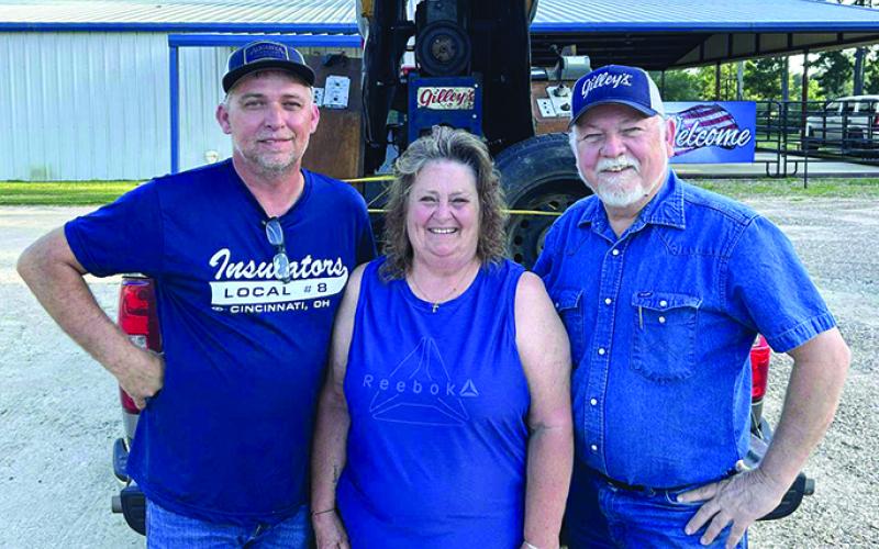 Gale Gregg, left, and his mother, Karen Bishop Gregg, pose with Gator Conley, one of the actors from the movie “Urban Cowboy.” Conley helped  build El Toro. Picture courtesy of Gale Gregg.