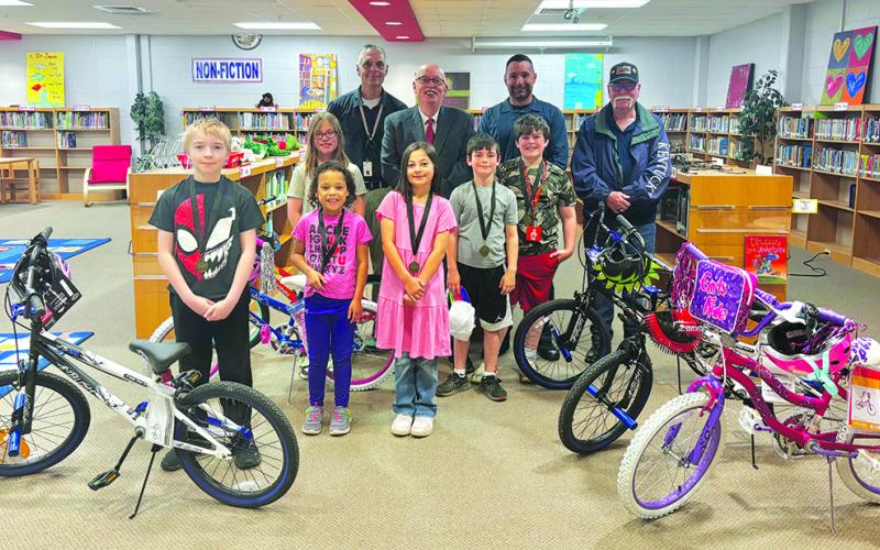 Southern Elementary School students rewarded in the Masonic Bicycles in Schools for Attendance Program are, from left, are Elijah Bess, Alynah Younger, Emma Barlow, Madalyn Butler, Levi Hilterbrand and Christopher Bishop. In the back row are SES Principal Mark Hegyi and Masons Rick Halcomb, Jeremy Moore and Steve Bowman.