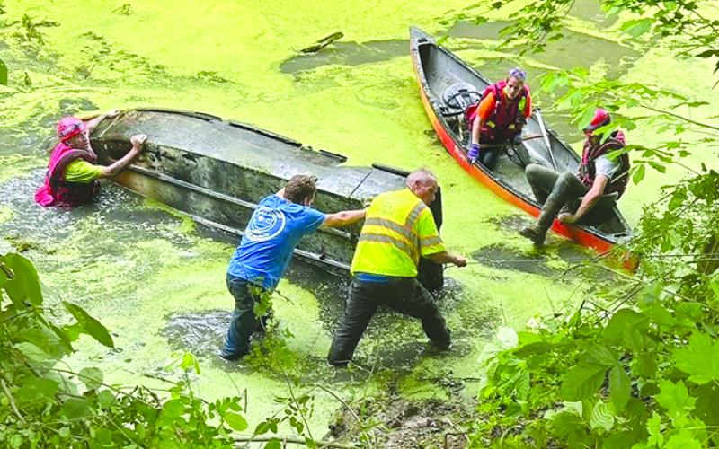 The county Fire and Rescue team focused on cleaning up a local lake in Butler, removing large items that includes a wooden boat ramp, canoe and jon boat that had been in the lake since 1989.