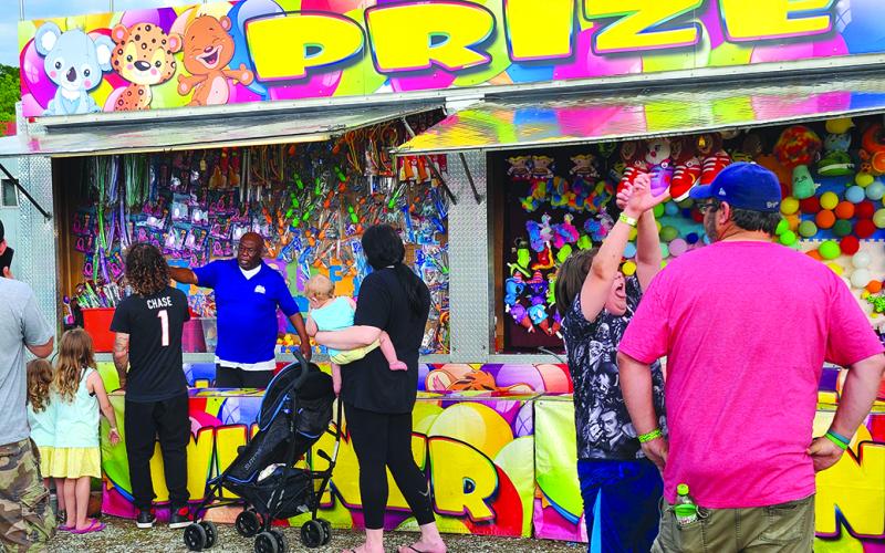 Colorful prizes abounded at the carnival portion of the Pendleton County Youth Fair. Photo by Burton Cole.