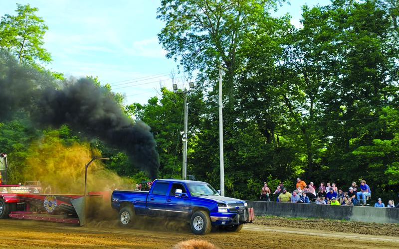 Smoke, dirt and the roar of engines filled the air Friday night during the truck and tractor pulls at the Pendleton County Youth Fair. Photo by Jenny Smith.