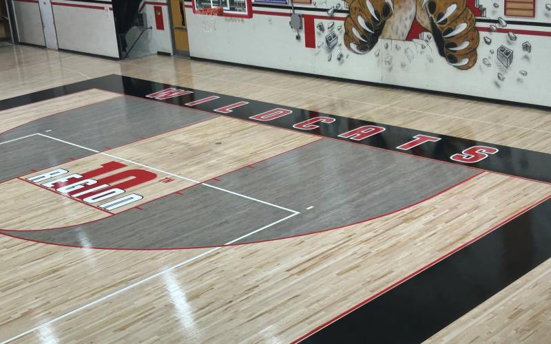 New additions include the 10th Region logo just inside of both free throw lines plus an outlined shape of Pendleton County with the initials 'PC' at mid-court.