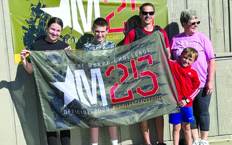 When 7-year-old Fielder Roth learned that some of his dad’s fellow Marine Corps friends were unable to participate in the Murph’s Challenge this year at Kincaid Lake State Park, he decided to join in so his dad would not be alone. Fielder did all the challenges (minus the weighted vest) and even beat his dad on the two runs. From left are Kasi Adams, Levi Wolfe, Jason Rother, Lynn Orr and Fielder. The challenge is a physical endurance workout designed to honor Navy SEAL Lieutenant Michael P. Murphy and all