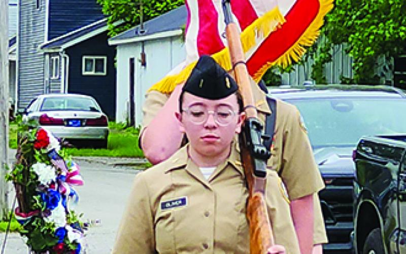 NJROTC Cadet Georgia Oliver takes the lead as cadets present colors during the Memorial Day ceremony.