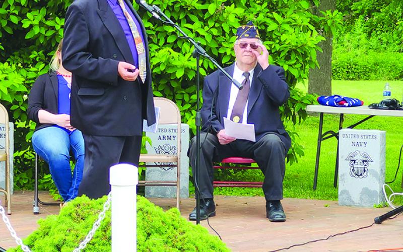 Guest speaker and Vietnam veteran Rick Lockhart recounts the stories of friends he lost during the war, emphasizing that freedom is not free.