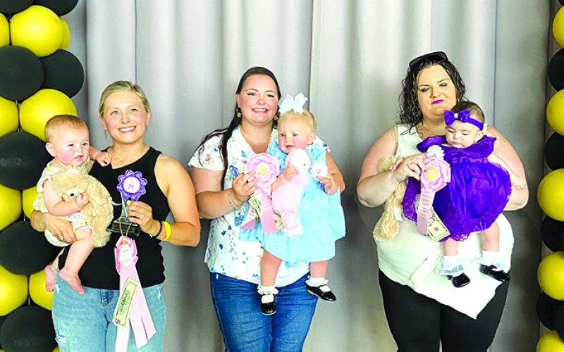 Leading the class of Girls 7 to 12 Months are Jordyn Figgins, winner; Ruby Engle, second; and Maria Miracle, third.