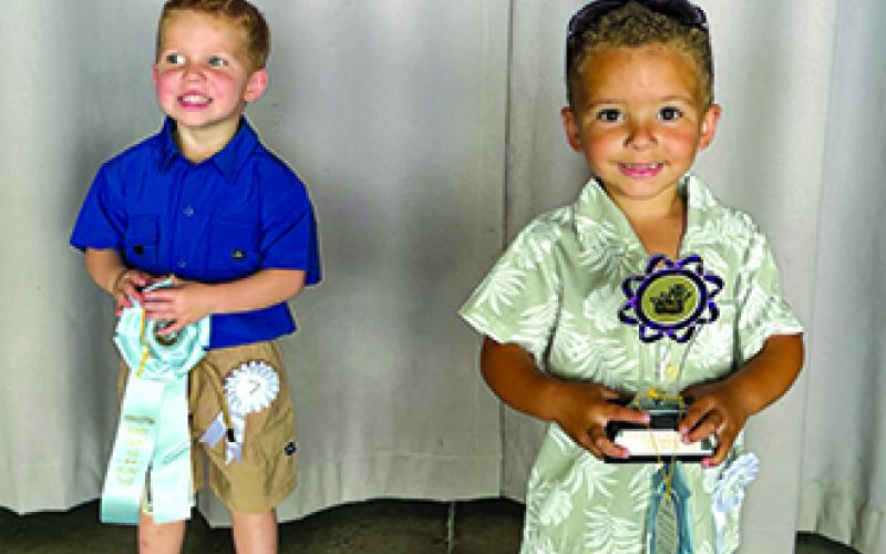 Finishing one-two in the Tiny Mister Cutie Pie contest are Kyrie Dodds, winner, and Trevor McEvoy, first runner-up.