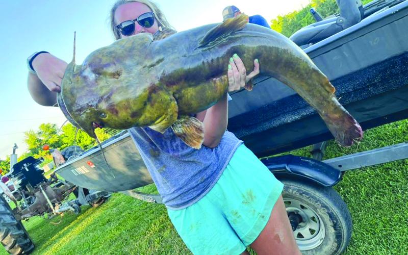 Kelsie McClanahan proudly displays a 36-pound flathead she caught in the Licking River at McKenneysburg. Photo courtesy of Kelsie McClanahan